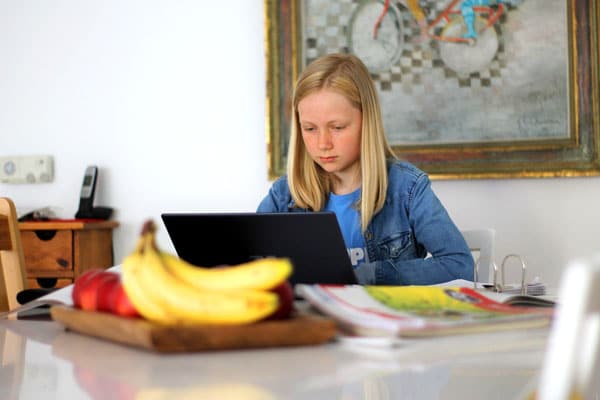 Homeschooling girl learning at table