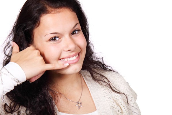 woman signalling a phone call