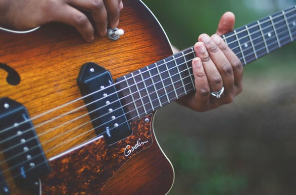 What are Creative Skills? Student learning to play guitar.