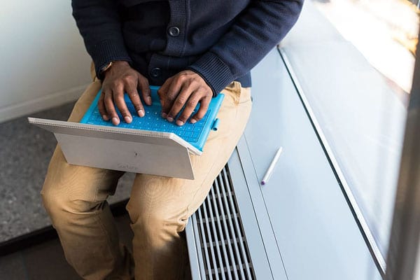 How Does Accounting Help Businesses? Man working on laptop.